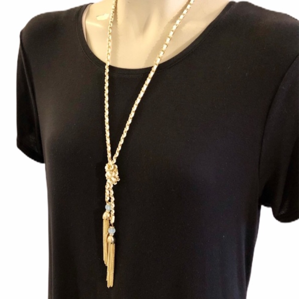 Gold tone / white knot necklace